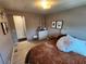 Comfortable bedroom with stylish decor, dresser, and natural light at 5316 Chateau Ln, Bradenton, FL 34207