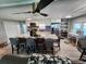 Open-concept kitchen featuring a large island with seating, white cabinets, and modern appliances at 5316 Chateau Ln, Bradenton, FL 34207