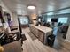 Modern kitchen with central island and open floor plan at 5316 Chateau Ln, Bradenton, FL 34207