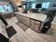 Spacious kitchen island with a dishwasher and ample storage, surrounded by neutral decor at 5316 Chateau Ln, Bradenton, FL 34207