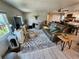 Open living room with stylish decor, plank flooring, and neutral wall color at 5316 Chateau Ln, Bradenton, FL 34207
