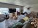 Bright living room with modern entertainment center and comfortable seating at 5316 Chateau Ln, Bradenton, FL 34207