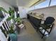 Inviting porch features a bar, seating, and a large potted cactus, creating a relaxing outdoor space at 5316 Chateau Ln, Bradenton, FL 34207