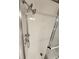 White shower with a glass enclosure and adjustable shower head, adding convenience and style at 5316 Chateau Ln, Bradenton, FL 34207