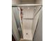 Enclosed white shower with sliding glass doors, and toiletries caddy for storage at 5316 Chateau Ln, Bradenton, FL 34207