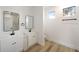 Elegant bathroom featuring dual sinks, modern mirrors, and bright natural light at 5386 Easter Ter, North Port, FL 34286