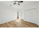 Bedroom with closet, ceiling fan, natural light and wood floor at 5386 Easter Ter, North Port, FL 34286