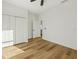 Bedroom with natural light, ceiling fan, closet and wood floor at 5386 Easter Ter, North Port, FL 34286
