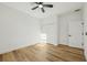 Bedroom with closet, ceiling fan, natural light and wood floor at 5386 Easter Ter, North Port, FL 34286