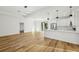 Modern kitchen with stainless steel appliances, white cabinets, and a quartz countertop at 5386 Easter Ter, North Port, FL 34286