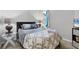 Cozy bedroom features soft lighting, a large comfortable bed, and a decorative quilt at 5981 Amberly Dr, Bradenton, FL 34208