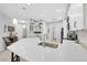 Kitchen with a large island, stainless steel appliances, and modern sink fixtures at 5981 Amberly Dr, Bradenton, FL 34208