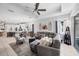 Bright and airy living room with tile flooring, ceiling fan, and lots of natural light at 5981 Amberly Dr, Bradenton, FL 34208