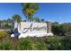 Amberly neighborhood sign with lush landscaping and blue sky in the background at 5981 Amberly Dr, Bradenton, FL 34208