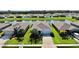 A beautiful single-Gathering home sits between two other homes and overlooks a picturesque pond at 6120 115Th E Ave, Parrish, FL 34219