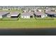 Rear view of homes backing up to a pond and well-manicured lawns at 6120 115Th E Ave, Parrish, FL 34219