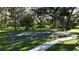 This basketball court is surrounded by lovely mature trees and lush green grass at 6120 115Th E Ave, Parrish, FL 34219