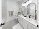 Modern bathroom featuring double sinks, black fixtures, and a minimalist aesthetic with clean lines at 6120 115Th E Ave, Parrish, FL 34219