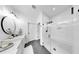 Modern bathroom boasts double sinks, a large shower with glass door, and sleek fixtures at 6120 115Th E Ave, Parrish, FL 34219