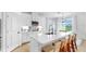 Bright kitchen features a large island with seating, white cabinets, and modern appliances at 6120 115Th E Ave, Parrish, FL 34219