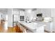 Spacious modern kitchen featuring a large island, stainless steel appliances, and white cabinetry at 6120 115Th E Ave, Parrish, FL 34219