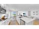 Modern kitchen featuring white cabinets, a stainless steel dishwasher, and a view to the lake at 6120 115Th E Ave, Parrish, FL 34219