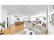 Open-concept living space featuring hardwood floors, modern furnishings, and an airy atmosphere at 6120 115Th E Ave, Parrish, FL 34219