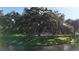 This beautiful community features a tennis court area surrounded by lovely mature trees and lush green grass at 6120 115Th E Ave, Parrish, FL 34219