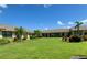 Well-maintained lawn and landscaping add to the curb appeal of this condo complex under a bright, sunny sky at 6132 29Th W Ave, Bradenton, FL 34209