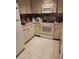 Functional kitchen with white appliances and ample cabinet space, offering a practical layout for meal preparation at 6132 29Th W Ave, Bradenton, FL 34209