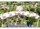 Aerial view of the building complex showing rooftops, green spaces, and parking areas at 618 Bird Bay S Dr # 113, Venice, FL 34285