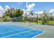 A community basketball court with well-maintained surface and secure fencing at 618 Bird Bay S Dr # 113, Venice, FL 34285