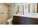 Bathroom featuring double vanity, tile shower, and modern fixtures at 618 Bird Bay S Dr # 113, Venice, FL 34285