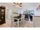 Open floorplan with the dining area flowing into the living room, offering lots of natural light at 618 Bird Bay S Dr # 113, Venice, FL 34285