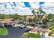Exterior of a well maintained building with covered entrance, landscaping and parking area at 618 Bird Bay S Dr # 113, Venice, FL 34285