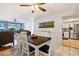 View of the dining space and kitchen offering an open-concept living space at 618 Bird Bay S Dr # 113, Venice, FL 34285