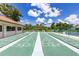 Shuffleboard courts with clearly marked numbers for easy play, set in a green park-like setting at 618 Bird Bay S Dr # 113, Venice, FL 34285