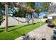This backyard features a lawn, a privacy fence, and a built-in game area at 6180 42Nd N Ave, St Petersburg, FL 33709