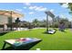 This backyard features a lawn, patio furniture, and a built-in game area at 6180 42Nd N Ave, St Petersburg, FL 33709