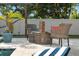 Outdoor patio with relaxing pool, lounge chairs, and game table, perfect for leisure and enjoyment at 6180 42Nd N Ave, St Petersburg, FL 33709