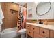 Bathroom featuring earth tone tile, a unique shower curtain, and a modern vanity at 6180 42Nd N Ave, St Petersburg, FL 33709