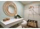 Bedroom featuring a vanity with a rattan mirror and a modern chair at 6180 42Nd N Ave, St Petersburg, FL 33709