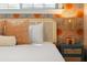 Bright bedroom featuring rattan headboard, patterned wallpaper, and unique decor at 6180 42Nd N Ave, St Petersburg, FL 33709