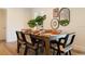 A bright and modern dining room showcases a stylish table setting and is adjacent to the living area at 6180 42Nd N Ave, St Petersburg, FL 33709