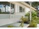 A charming front porch offers a swing, fresh paint, and an invitation to relax in this home at 6180 42Nd N Ave, St Petersburg, FL 33709