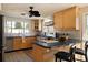 Bright kitchen featuring wood cabinets, stainless steel appliances, and an island with bar seating at 6180 42Nd N Ave, St Petersburg, FL 33709