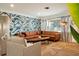 This living room features a comfortable leather sofa and stylish accents at 6180 42Nd N Ave, St Petersburg, FL 33709
