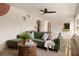 Comfortable living room featuring a wall mural, hardwood floors, and modern furniture at 6180 42Nd N Ave, St Petersburg, FL 33709
