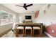 Bright living room boasts unique wall art, modern ceiling fan, and a stylish console table at 6180 42Nd N Ave, St Petersburg, FL 33709
