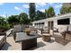 Outdoor patio with comfortable seating area, fire pit, and lush landscaping perfect for outdoor gatherings at 6180 42Nd N Ave, St Petersburg, FL 33709